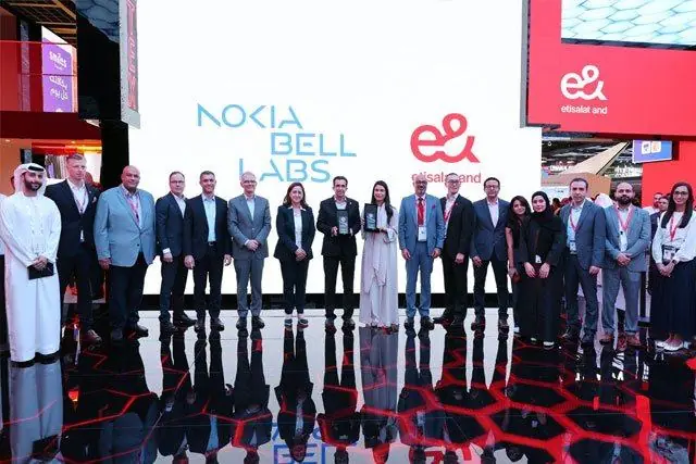 Nokia Bell Labs and e& teams with their awards on the e& stand at GITEX