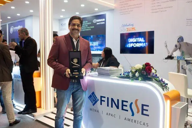 Finesse with their award on the Finesse stand